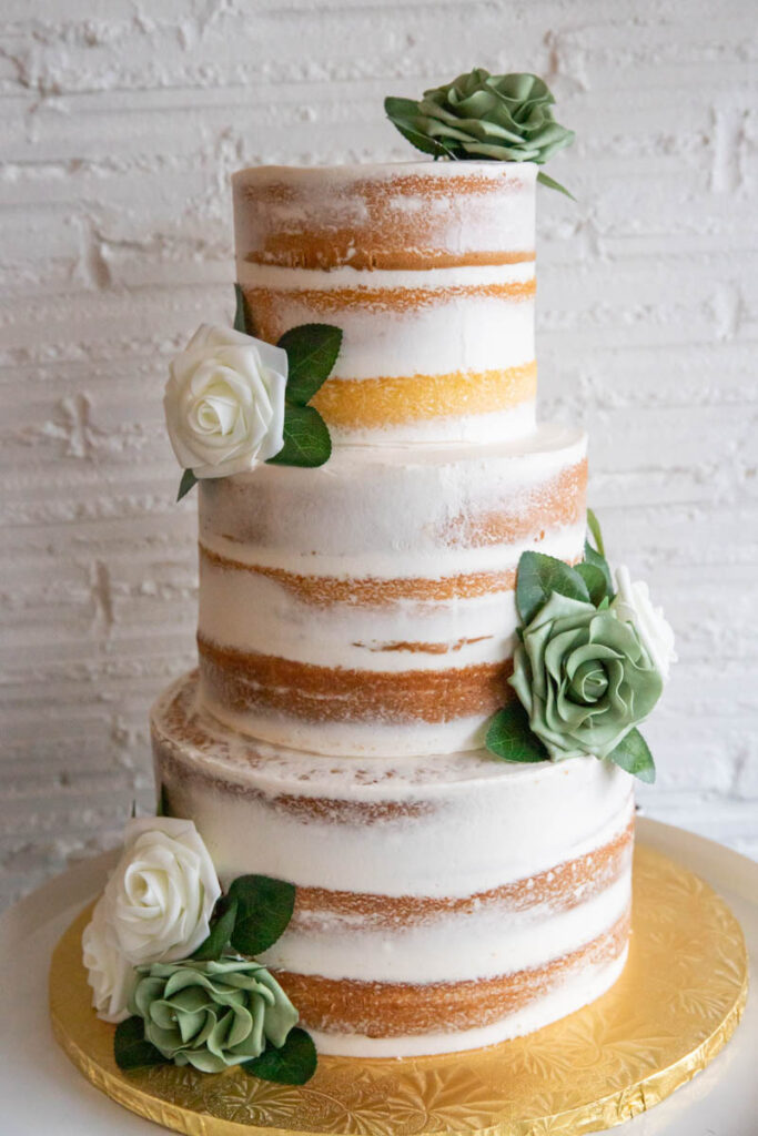 Naked cake French Buttercream design. Silk flowers placed offset.